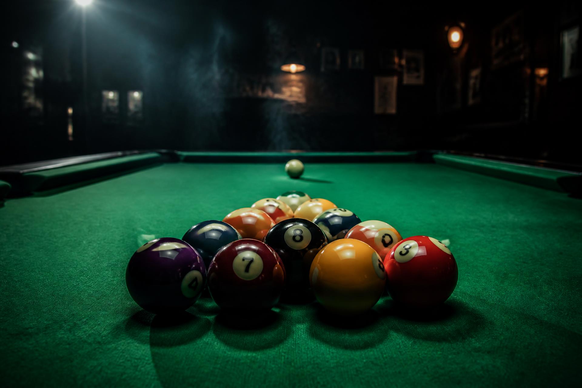 Pool balls racked on green felt